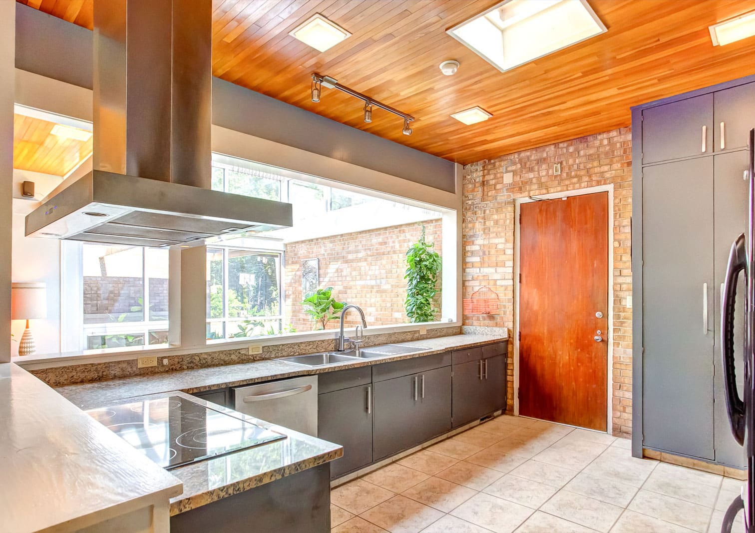 a kitchen with a sink and a window